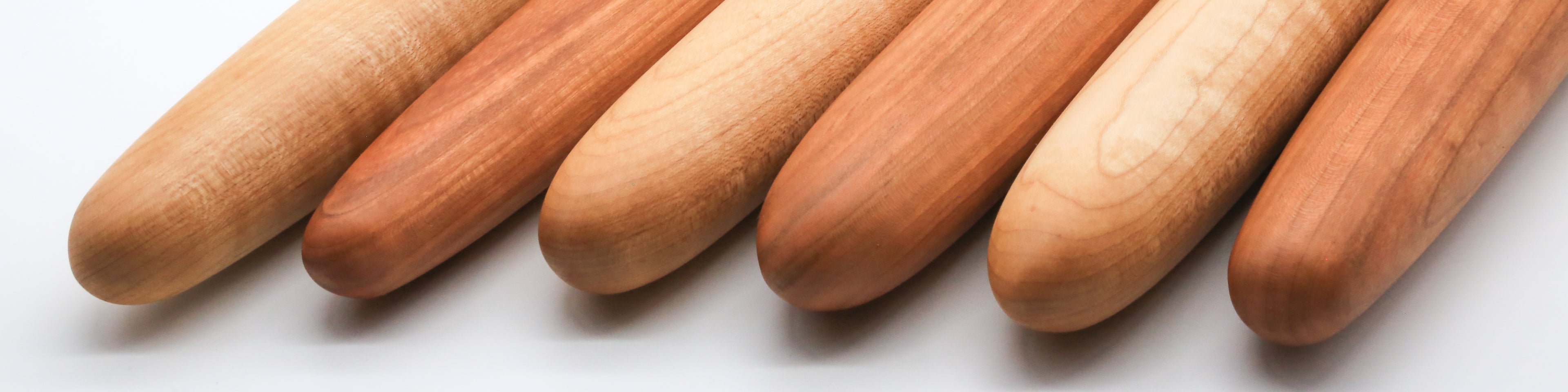 Gorgeous, smooth cherry and maple wooden French style rolling pins handmade by Camino Woodshop