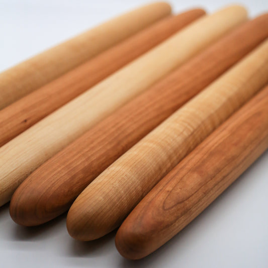 Gorgeous, smooth cherry and maple wooden French style rolling pins handmade by Camino Woodshop in Milwaukee, WI