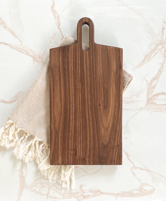 Handmade modern looking dark wooden large rectangle charcuterie/cutting board made by Camino Woodshop in Milwaukee, WI