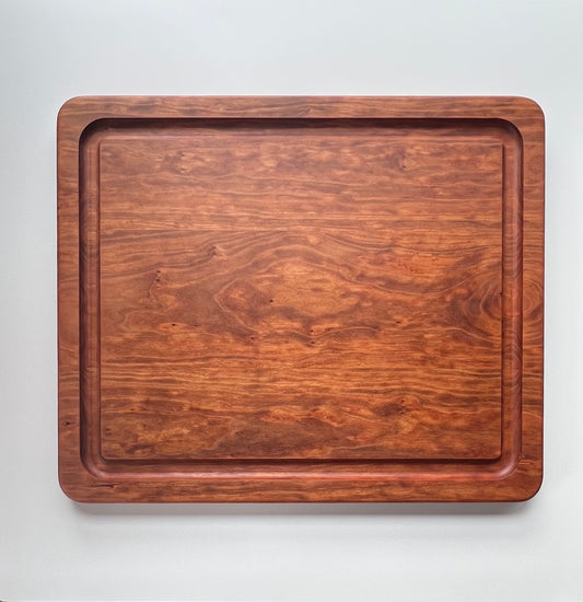 Beautiful, natural cherry wooden butcher block cutting board with juice groove