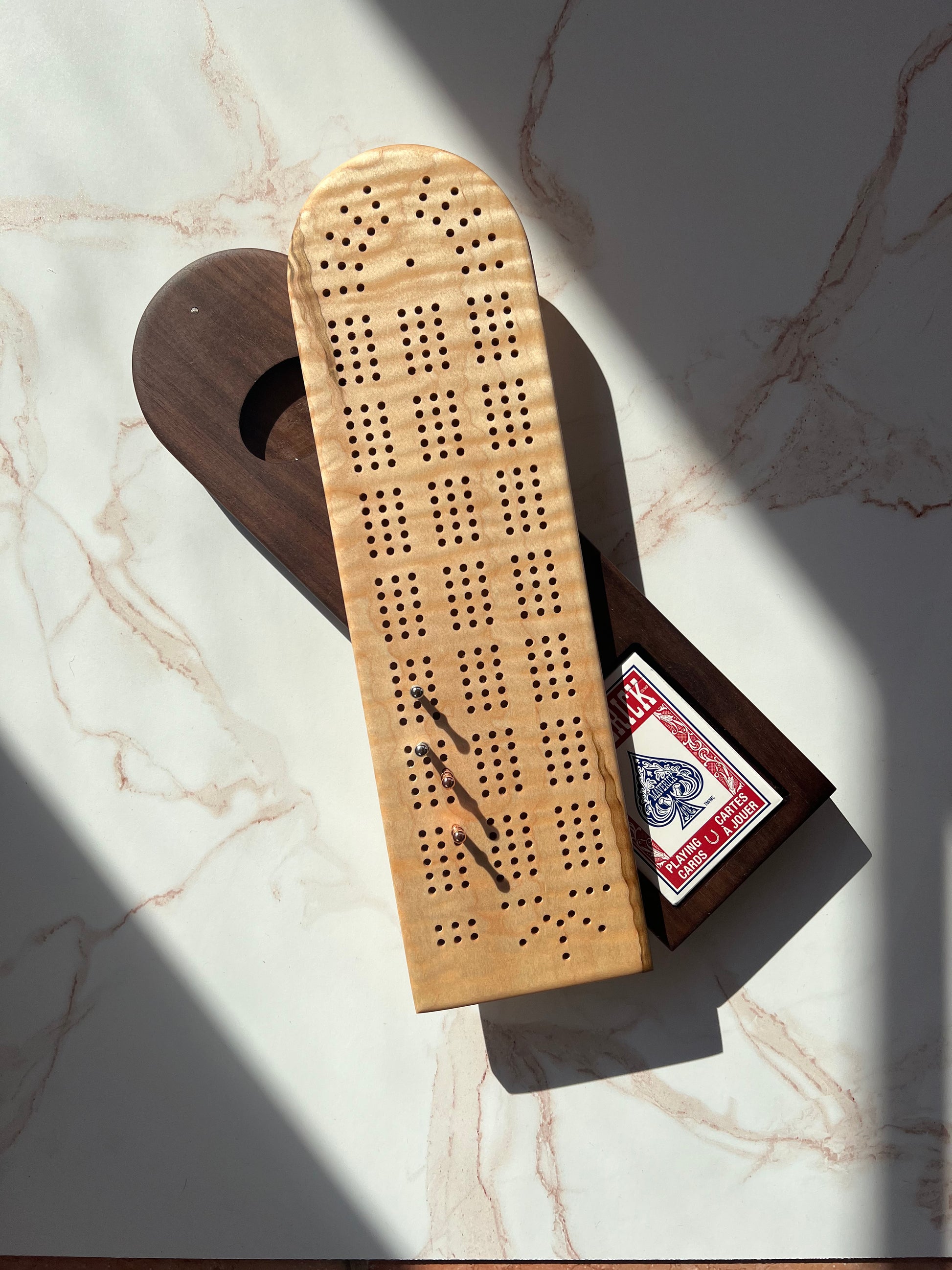 Stunning, handmade wooden cribbage board, light natural wood on top and a swivel card and peg storage with dark wood on the bottom